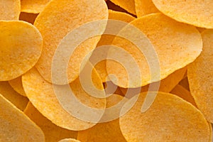Close up potato chips on wood top view background.