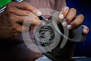 Close up potter artist working on clay pottery sculture fine art