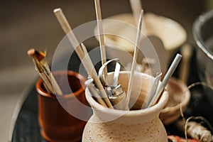 Close-up of pottery tools at ceramic workshop.