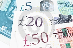 Close-up of 5, 20 and 50 pound sterling England currency banknotes, Brexit, UK United Kingdom economics, saving, financial or