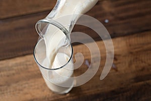 Close up - pouring milk into glass