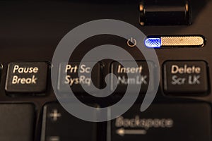 Close-up power button on computer keyboard