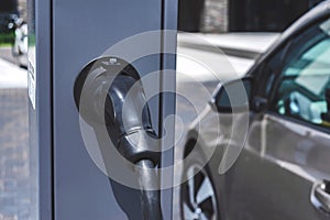 Close-up, power supply for the station, charging electric vehicles. On the background of the car