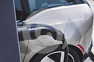 Close-up, power supply for the station, charging electric vehicles. On the background of the car