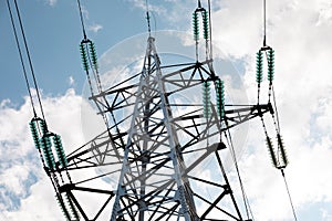 Close-up of power tower against blue sky