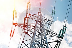 Close-up of power tower with wires in front of sky