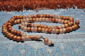 Close up prayer beads isolated on prayer rug