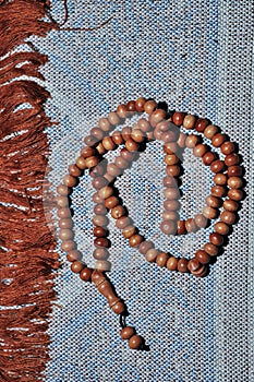 Close up prayer beads isolated on prayer rug