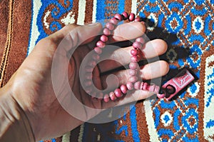 Close up prayer beads isolated on prayer rug