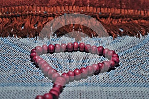 Close up prayer beads isolated on prayer rug