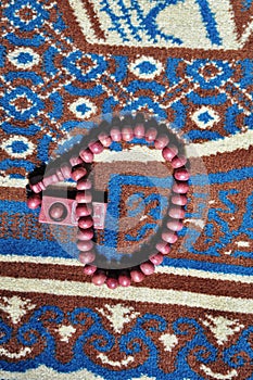 Close up prayer beads isolated on prayer rug