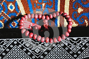 Close up prayer beads isolated on prayer rug