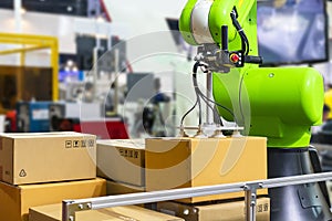 Close up precision robot arm and automatic vacuum or suction cup for pick - place transport paper box or various material sheet