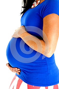 Close-up of a pregnant mother wearing a blue top