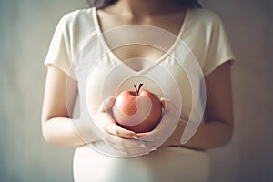 Close up of pregnant woman holding apple in hand. Healthy food concept. Generative AI