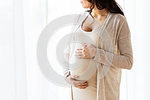 Close up of pregnant woman looking to window