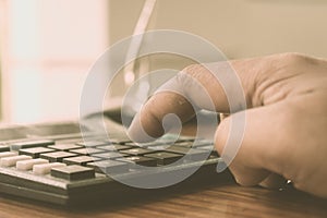 Close up of Press the right button. Calculator with finger. Fingers pressing the buttons of calculator. A businessman typing hand