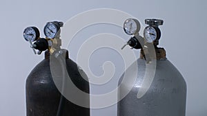 Close-up of pressure sensors on oxygen tanks in the operating room. Metal cylinders with compressed oxygen gas stand