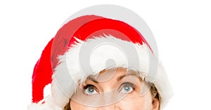 Close up of pretty mature woman wearing santa hat for christmas