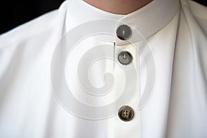close-up of priest collar button detail