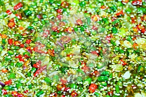 Close up of Prig Nam Pra or Fish sauce mix with chilli, garlic and lime, thai street food market
