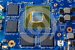 Close up of a printed blue computer circuit board