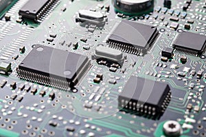 Close up of printed circuit board with electronic components selective focus