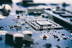 Close-up printed circuit board with electronics components. Macro photography for electric background. PCB with microchip, process