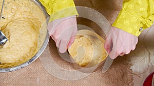 Close-up of the process of cooking delicious Easter cakes with raisins and candied fruits on the table. Easter holiday