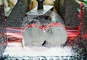 Close-up process of metal machining by saw