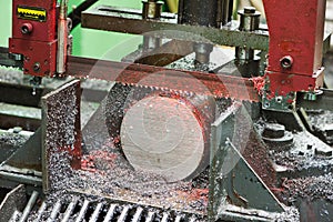 Close-up process of metal machining by saw