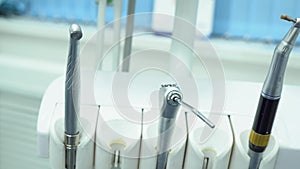 Close-up of professional dental instruments. Media. Metal various sterile tools in dental office ready for application