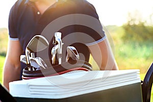 Close up of professional golf gear on the golf course at sunset