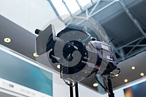 Close-up of a professional television camera.