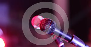 Close up of a professional vocal wire microphone on a microphone stand