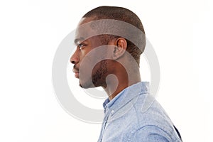 Close up profile of handsome young black man against isolated white background