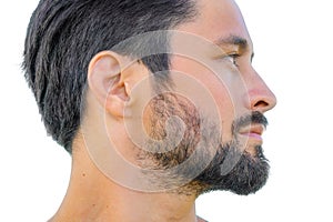 Close up profile portrait of healthy man with black hair, strong features, looking straight ahead