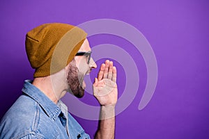 Close-up profile side view portrait of his he nice attractive bearded guy announcing new novelty copy space isolated