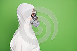 Close-up profile side view portrait of his he nice confident professional disinfectant wearing gas mask decontamination