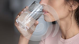 Close up profile thirsty woman drinking pure mineral water