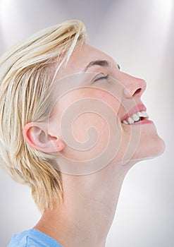 Close up profile of woman eyes closed against white background