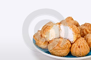 Close up of Profiteroles Fresh Cream puffs cakes filled with pas