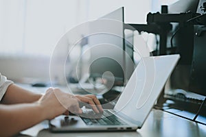 Close-up programmer's hands are working on computer. Modern IT technologies