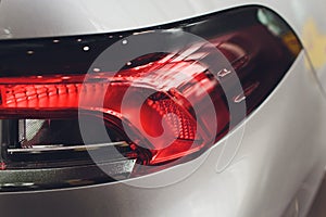 Close up projector Taillight of the modern and elegant car, automotive part concept.