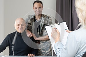 Close up of psychologist analyzing military patient behaviour