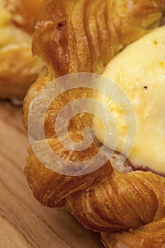 Close up of puff pastry cheese danish with vanilla custard