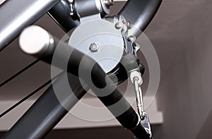 Close up pulley of gym equipment with handle