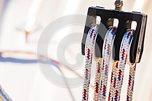 Nautical background, rigging ropes on pulley of sailing boat deck