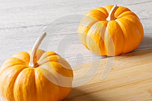 Close up of punkins for Halloween decorations on wooden background