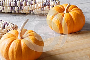 Close up of punkins for Halloween decorations on wooden background